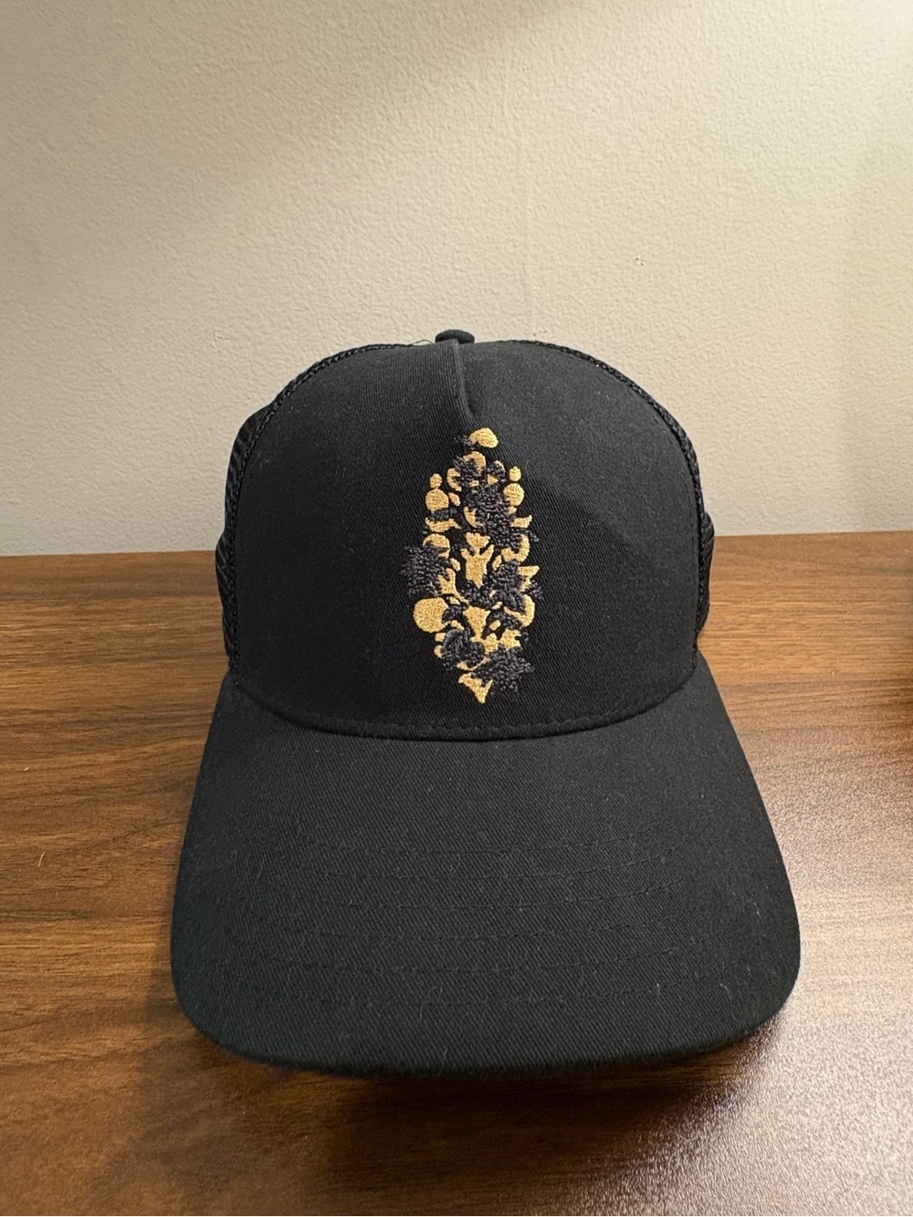 FP Movement by Free People Black snap back trucker style with Gold Floral Motif